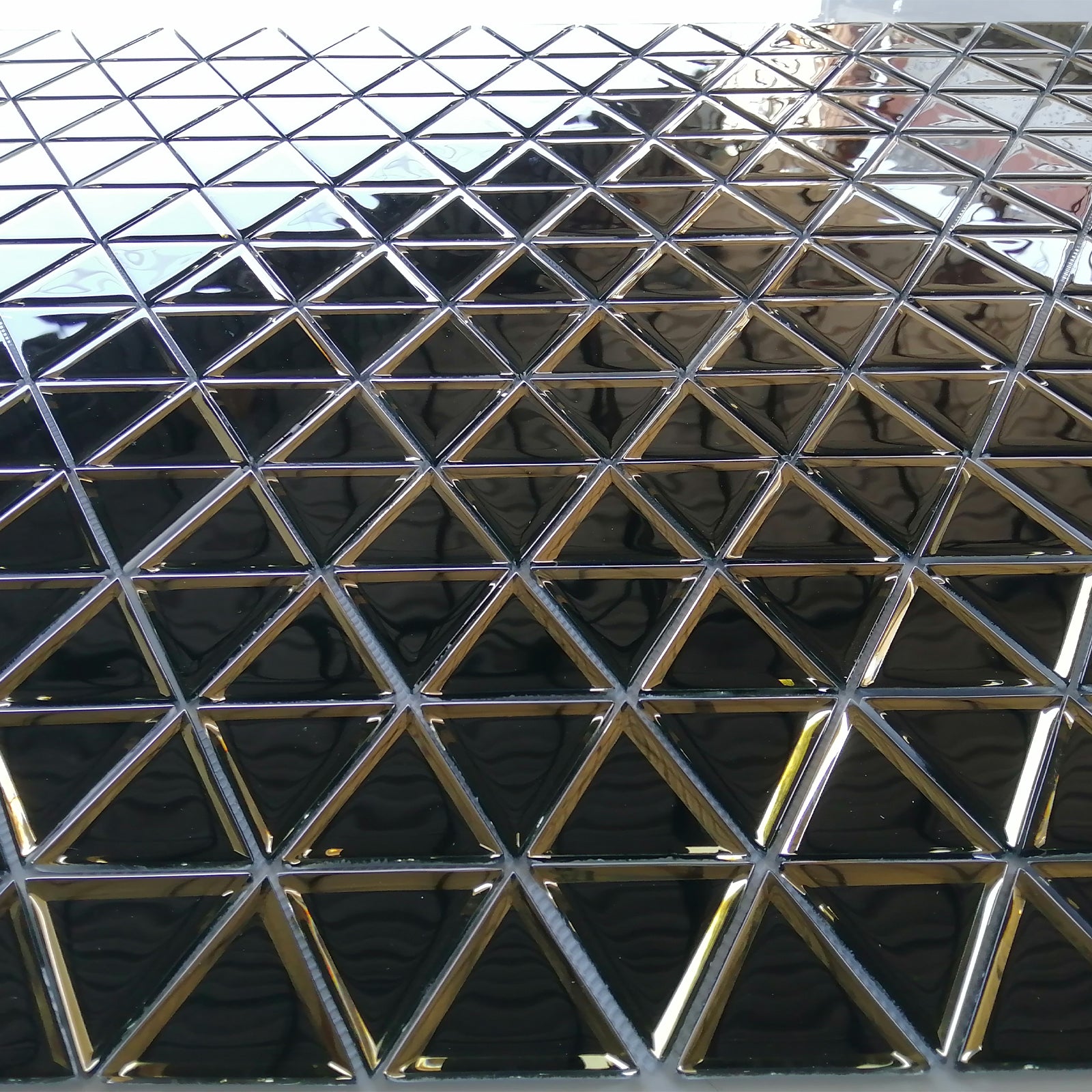 The golden equilateral triangle glass mosaic, with each grain closely connected, brings geometric beauty to your wall.