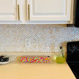 Each tile is a masterpiece of nature, showcasing a mesmerizing play of colors that evoke the shimmering depths of the ocean.