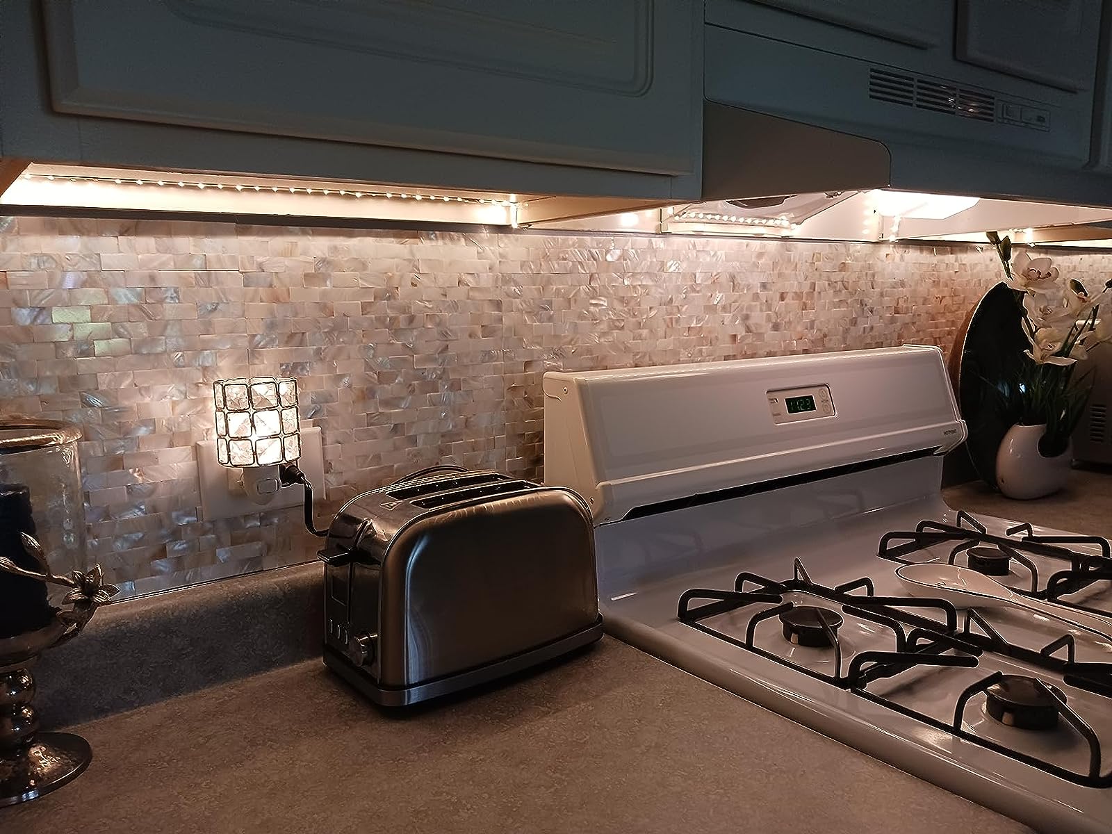 Diflart mother of pearl peel and stick tiles are great for kitchen backsplashes!