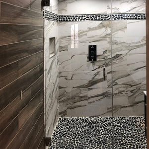 Say goodbye to slippery shower floors with Diflart pebble tile.