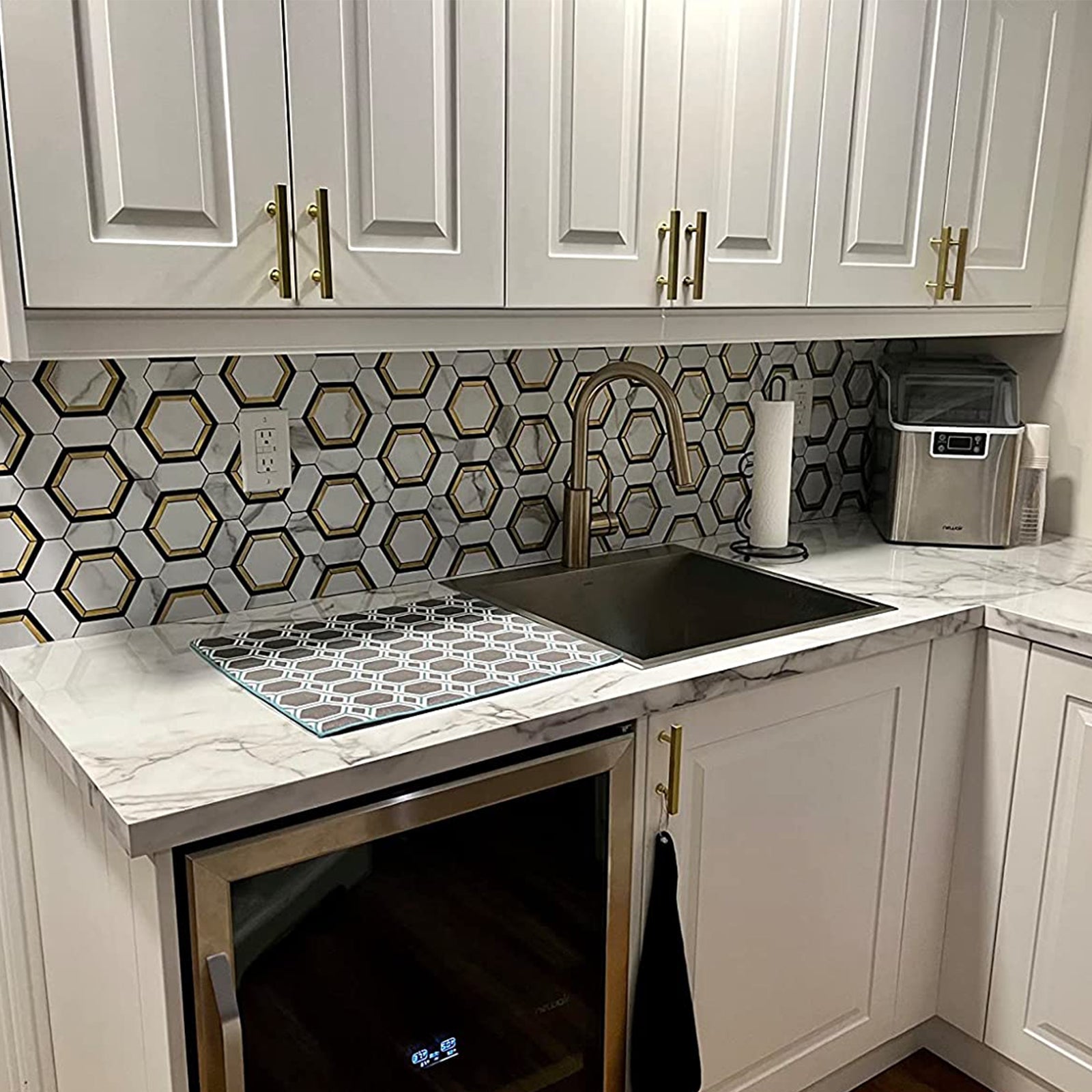 Selected materials, exquisite craftsmanship, Faux White Marble with Gold PVC and Metal Hexagon Tile, add a touch of timeless charm to your home décor.